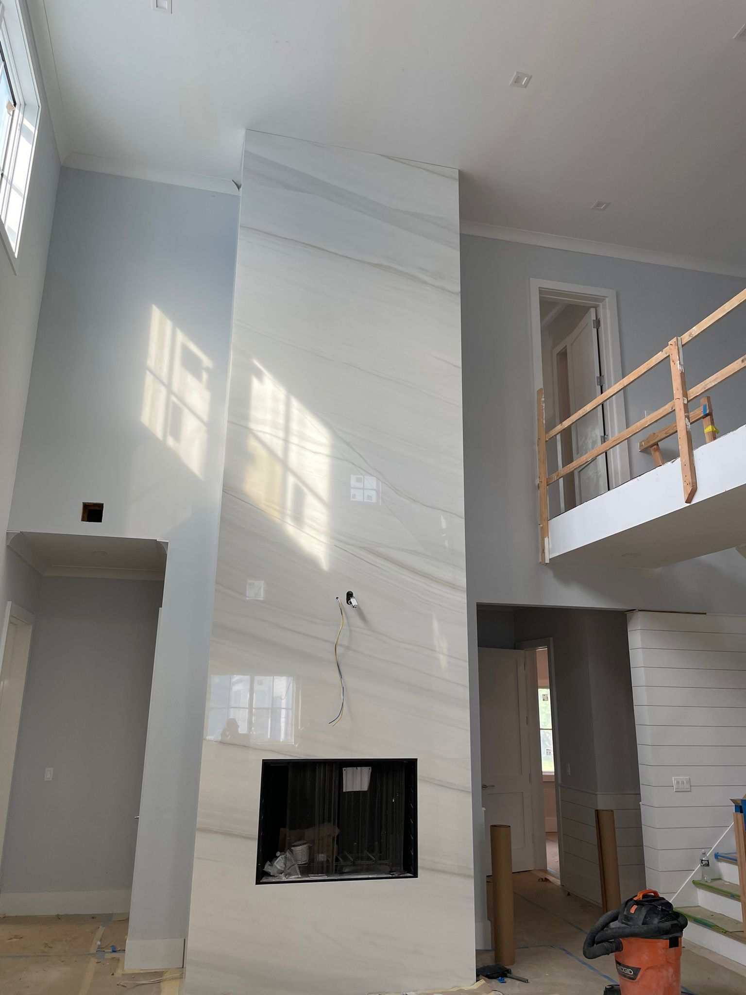 There is a fireplace in the middle of the room.