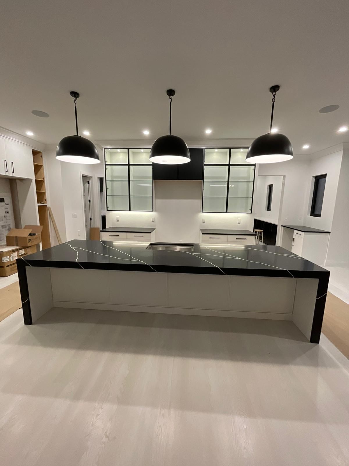 There is a large island in the middle of the kitchen.