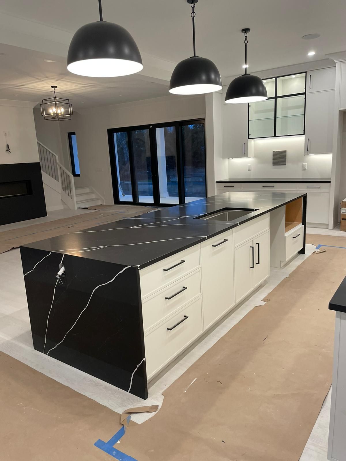 A kitchen with a large island in the middle of it.