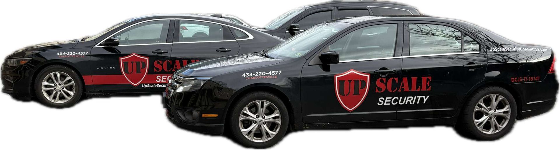 Two black sedan cars with SCG Security logos on the sides
