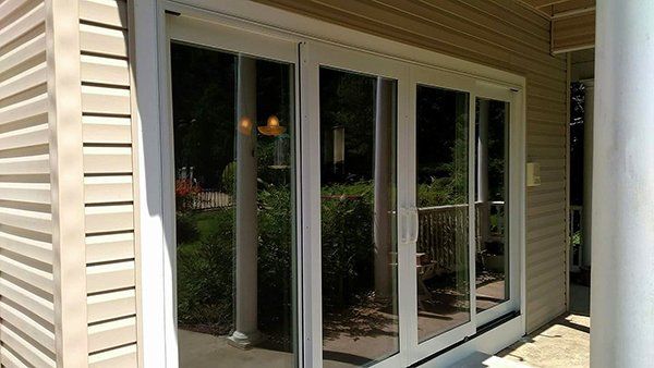 A house with sliding glass doors on the side of it