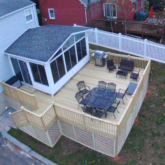 An aerial view of a deck with a table and chairs