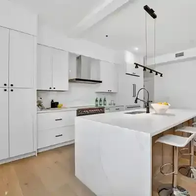 Modern unit showing a kitchen and empty living room