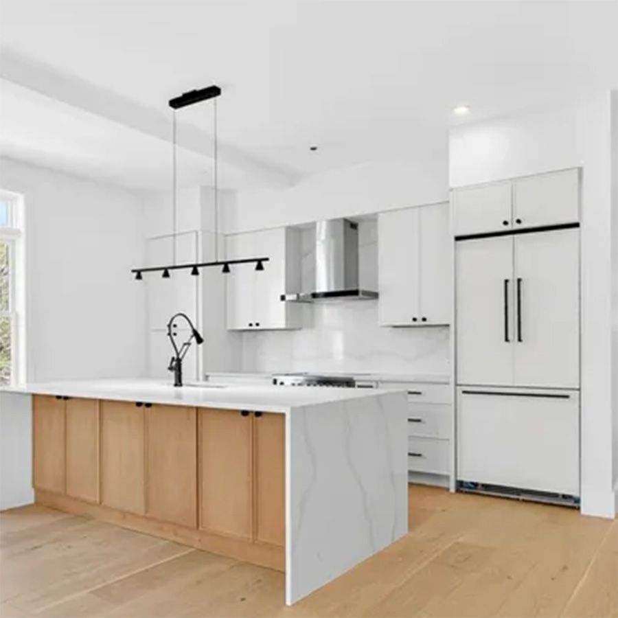 Modern unit showing a kitchen and empty living room