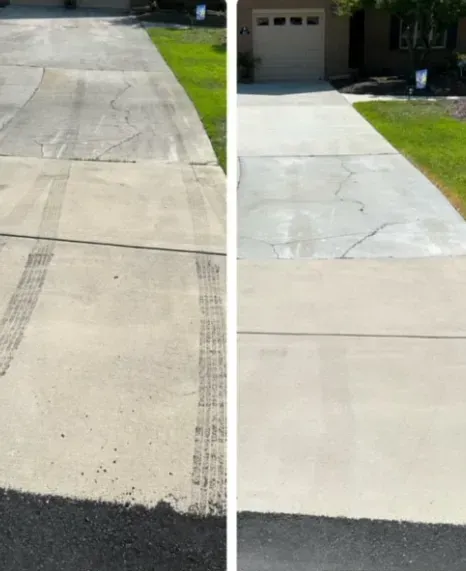 Before and after photo of a concrete driveway being cleaned, showing dirt and tire marks removed.