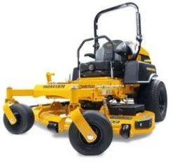 A yellow and black lawn mower is sitting on a white surface