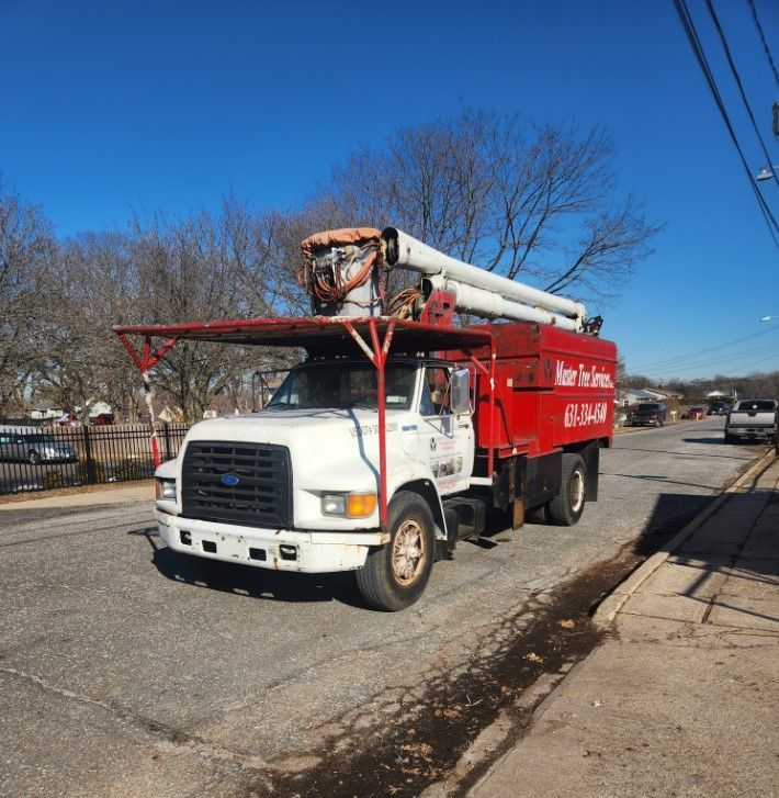A red and white truck that says ken for hire on the side