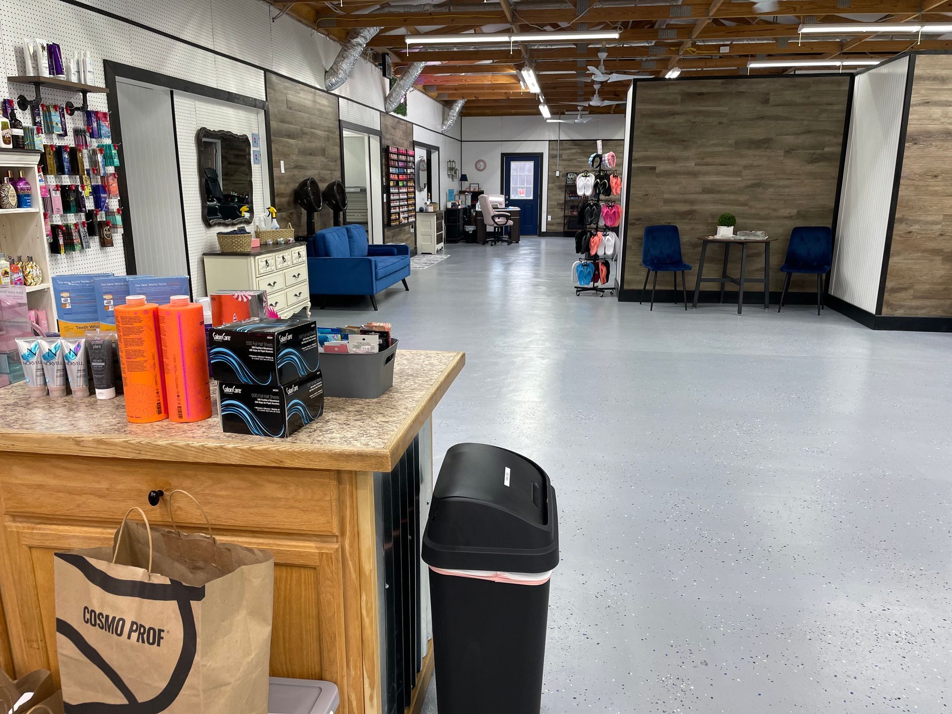 There is a trash can in the middle of the room.