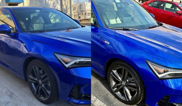 Two blue Acura Integra cars parked side by side. One has black wheels and the other has silver.