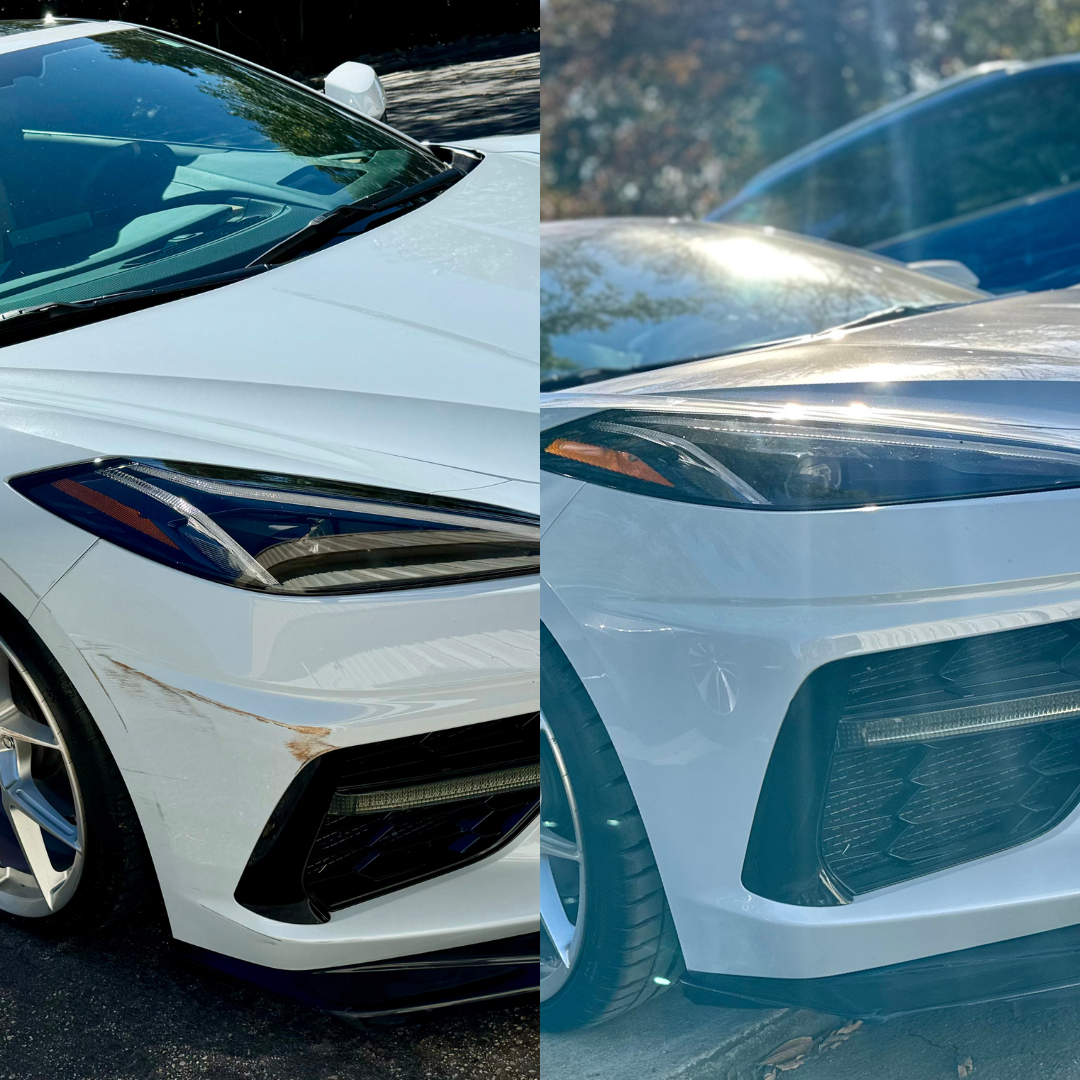 White sports car, showing front end with headlights and grill, parked outdoors.