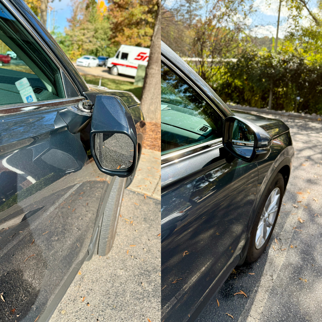Car's side mirror damaged, then repaired. Dark car, outdoors. One mirror hanging off, other in place.