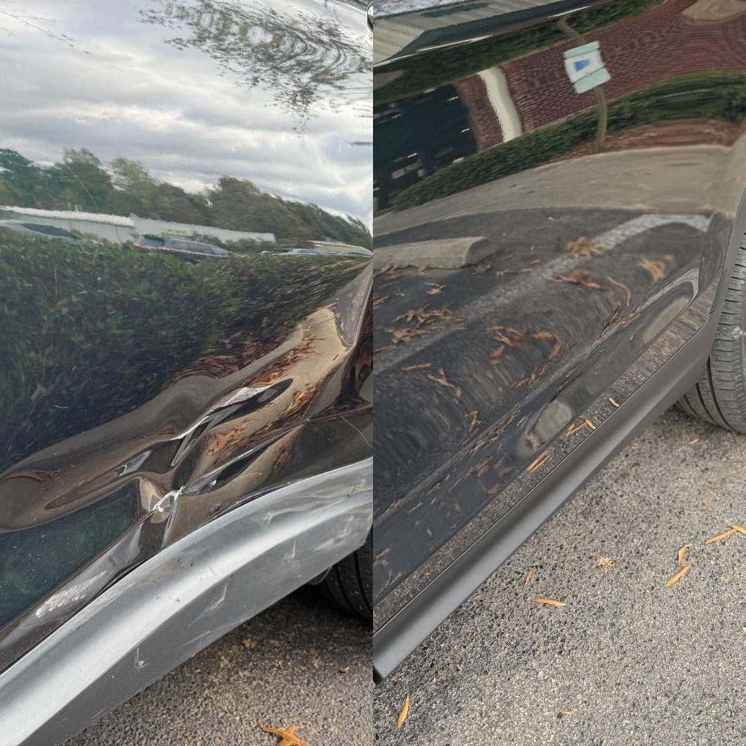 Damage to a black car's side panel and door, showing a dent and scratches, set outdoors on asphalt.
