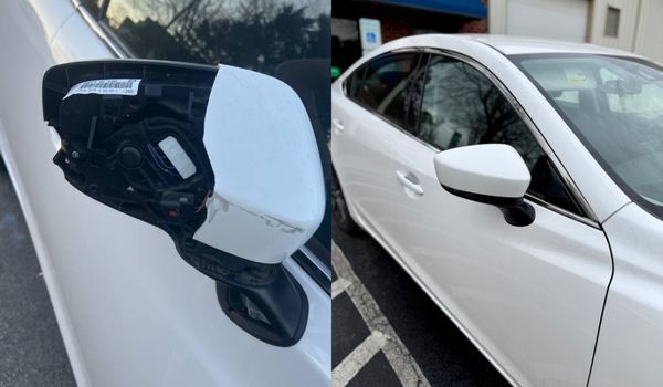 White car with a broken side mirror. The other mirror is intact.