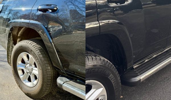 Two dark-colored vehicles: a 4Runner on the left and a truck on the right, showing rear tires and wheel wells.