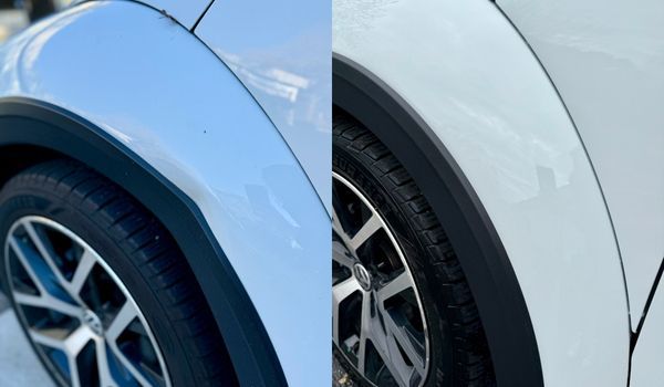 Two white car fenders with black wheel well trim, side-by-side.