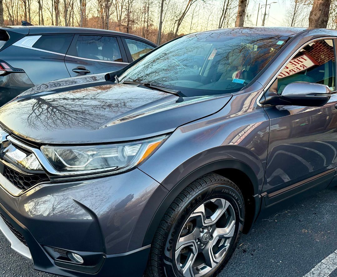 Gray Honda CRV parked outdoors.