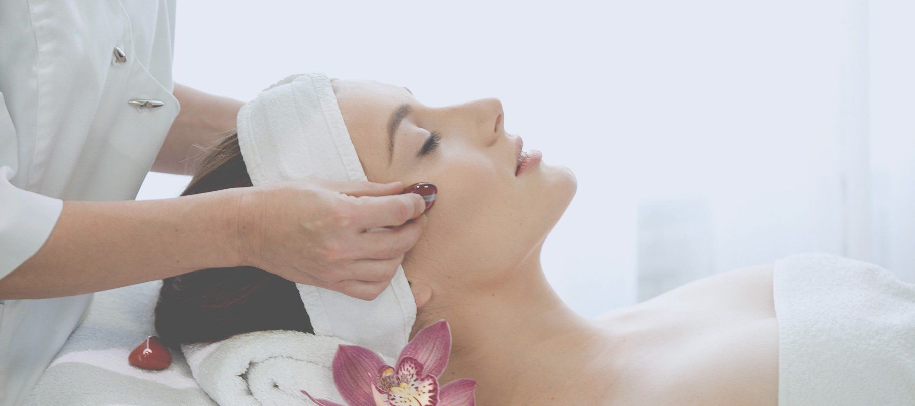 a woman having a relaxing facial massage