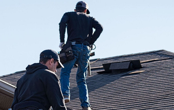 Roofers doing inspection of residential shingle roof