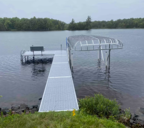 A dock with a canopy over it is in the middle of a lake