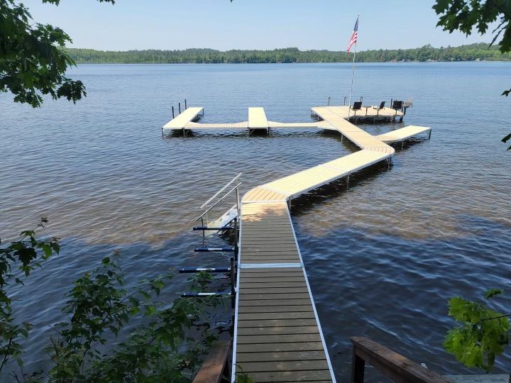 dock by the lake that can accommodate 3 boats