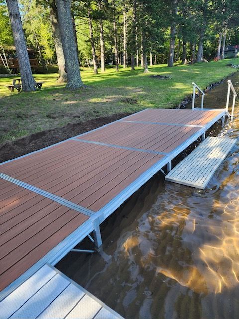 A wooden dock is next to a body of water