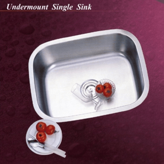 Stainless steel undermount single sink with tomatoes and a plate with silverware.