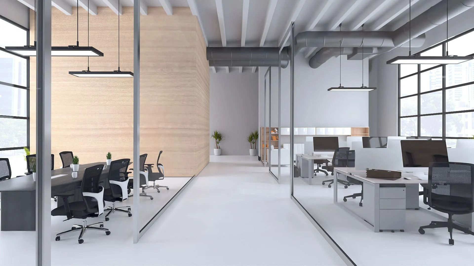 Bright modern open-plan office with desks, chairs, computers, and large windows