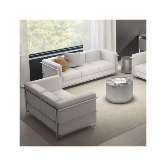 Modern living room with white sofas, round coffee table, and large window overlooking greenery