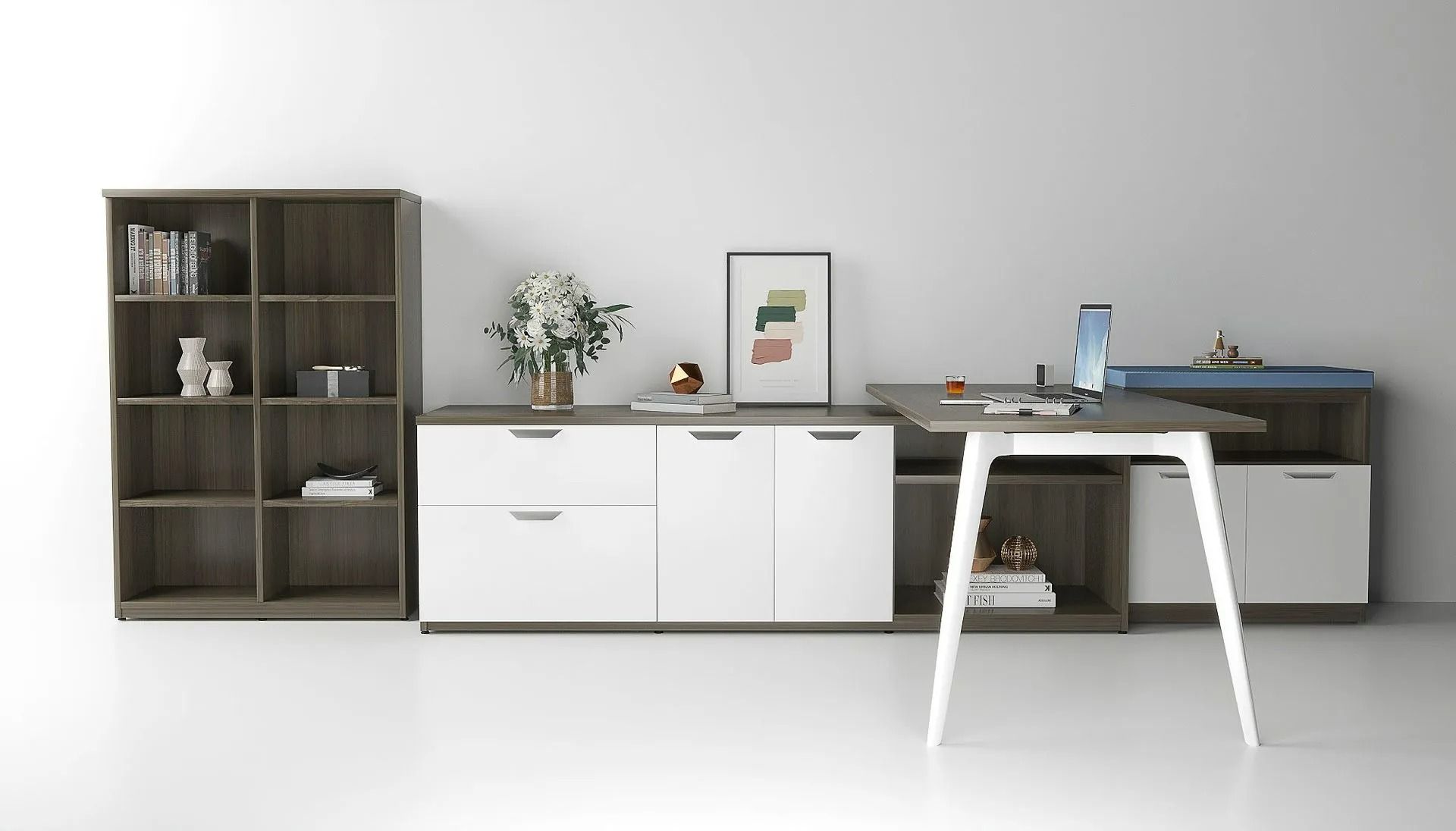 Minimalist white office with shelves, cabinets, desk, laptop, and a small table in front.