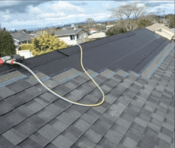 man installing new roof