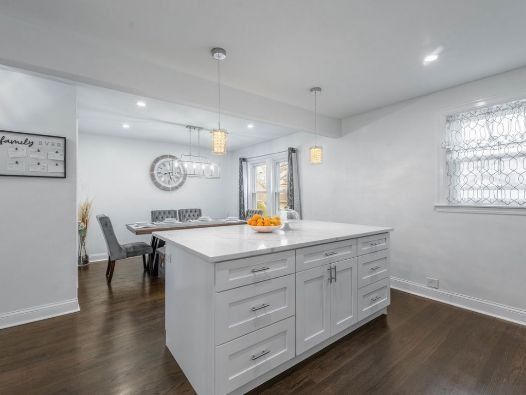 There is a large island in the middle of the kitchen.