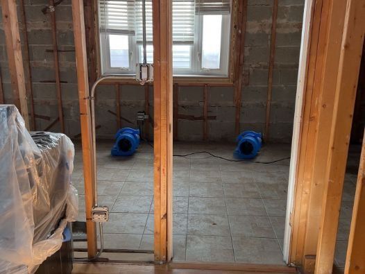 A room with a lot of wooden walls and a window.