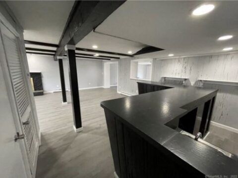 There is a bar in the middle of the room.