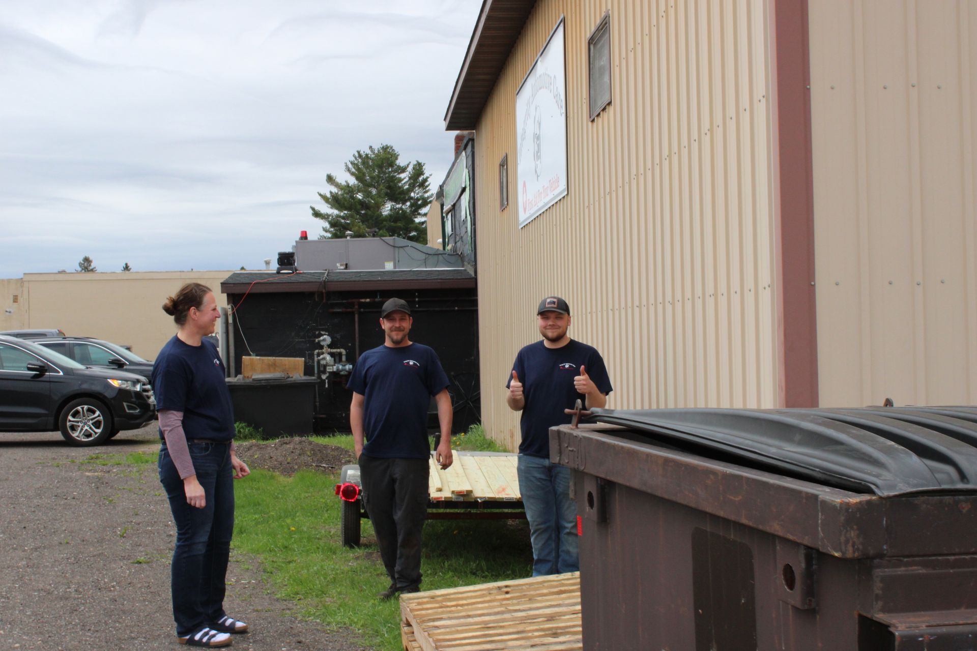 A group of people are standing in front of a building.