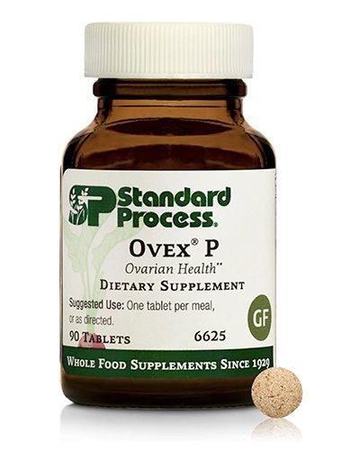 Standard Process Ovex P dietary supplement bottle with beige tablet on white background.