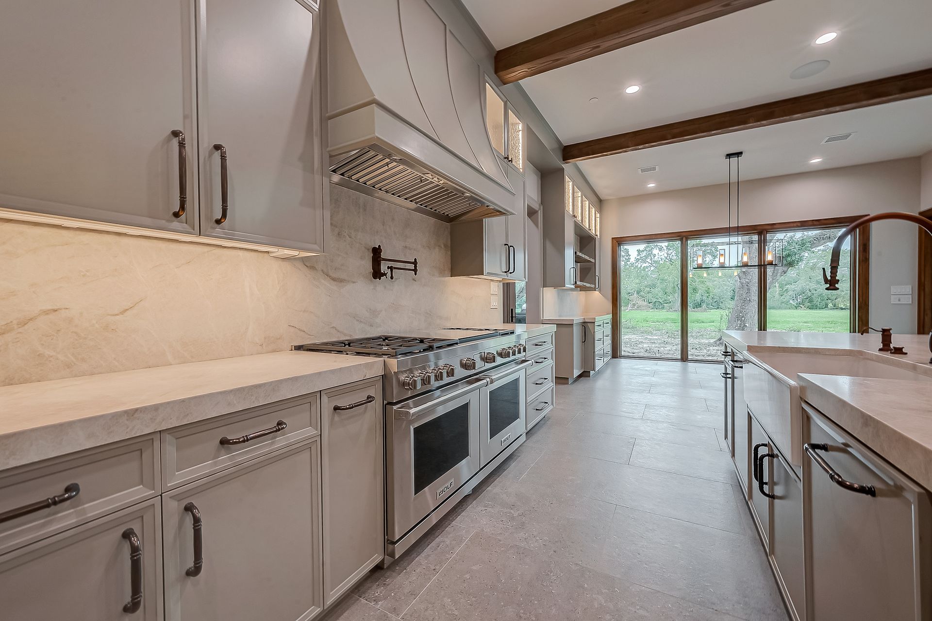 A kitchen with granite counter tops and wooden cabinets