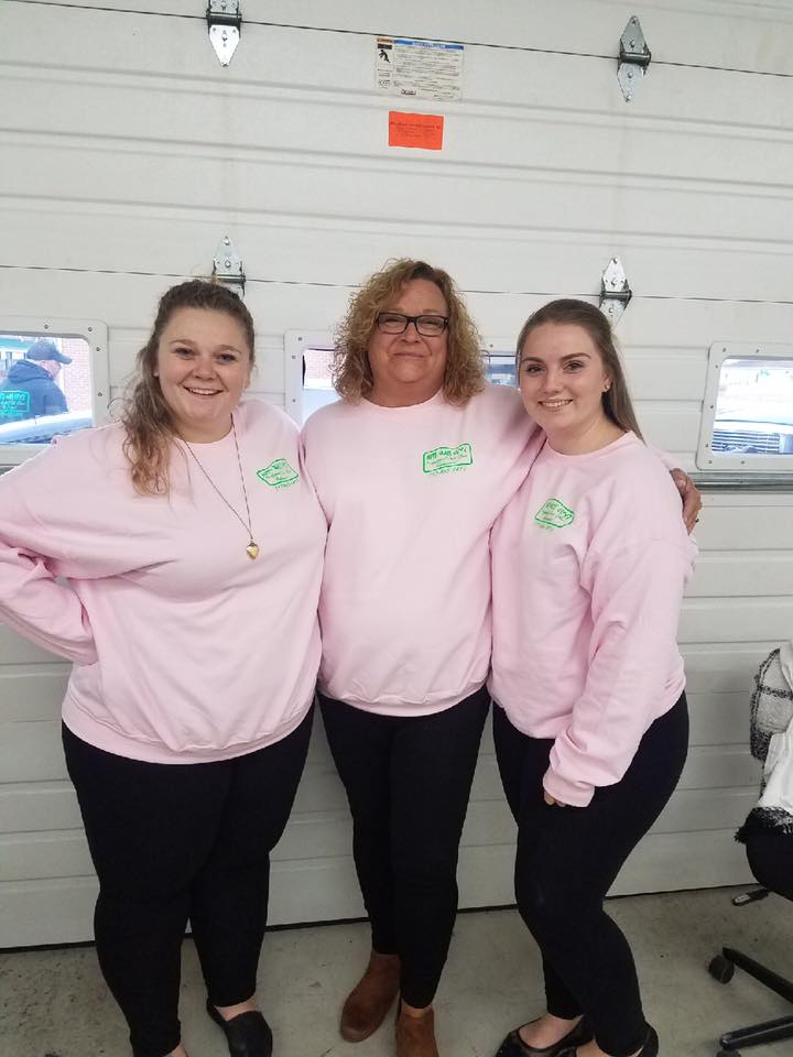 Three woman with company shirt