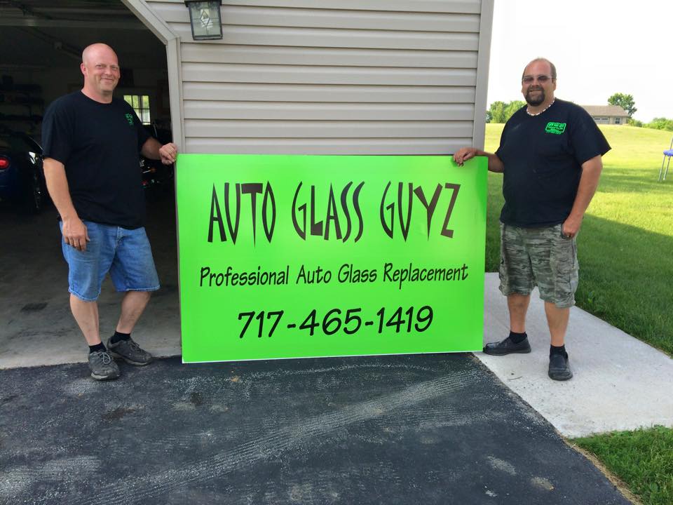 Company sign holding by two guy