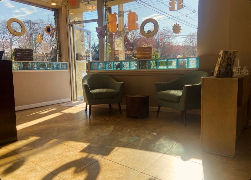 We'll be here. Reception area from within, door open, natural light coming in