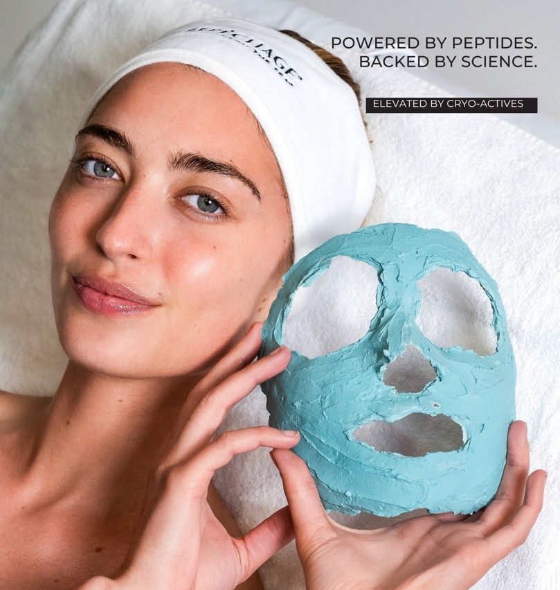 A person holding a cast for a blue cryo facial mask