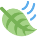 A green leaf blowing in the wind, indicated by three blue curved lines above it.