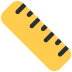 A yellow ruler positioned diagonally with black tick marks along its edge.