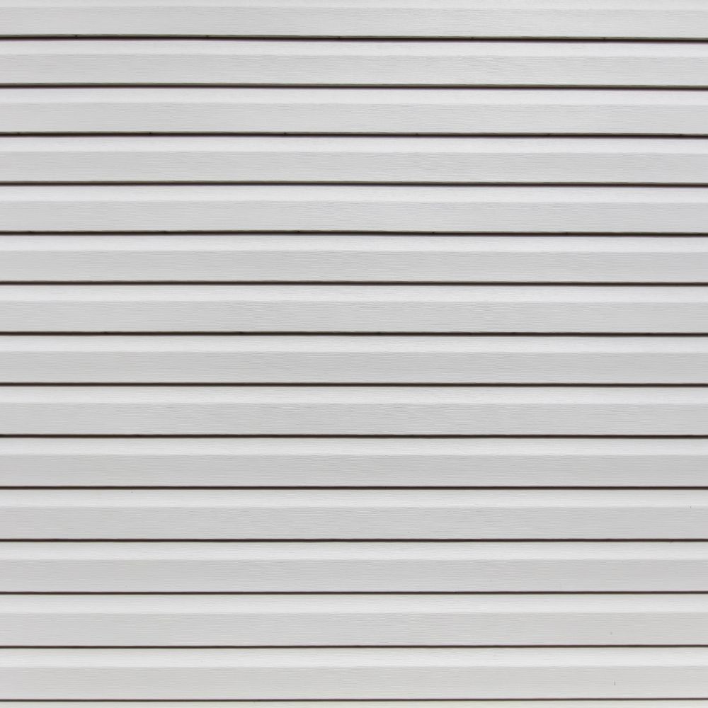 A close-up of white horizontal vinyl siding panels with repeating parallel lines and shadows.