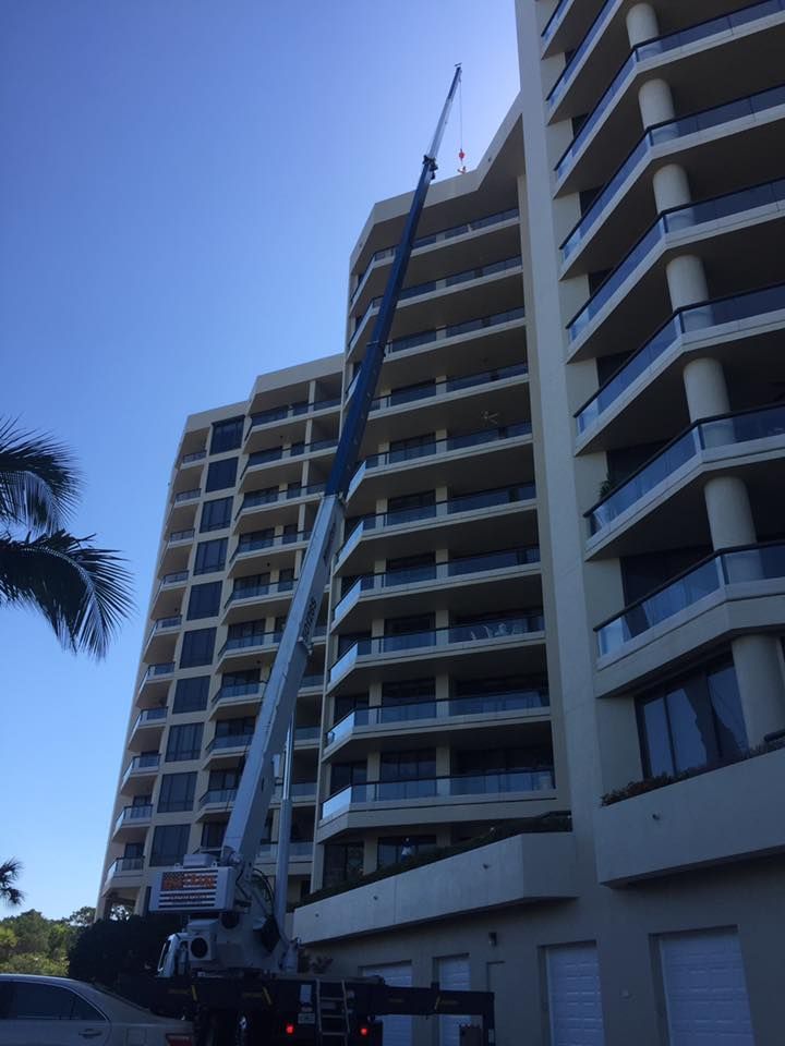 A large building with a crane on top of it.