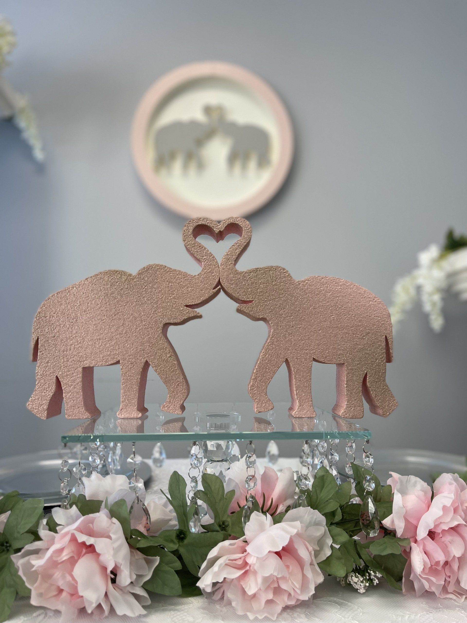 Two elephants touching trunks foam display