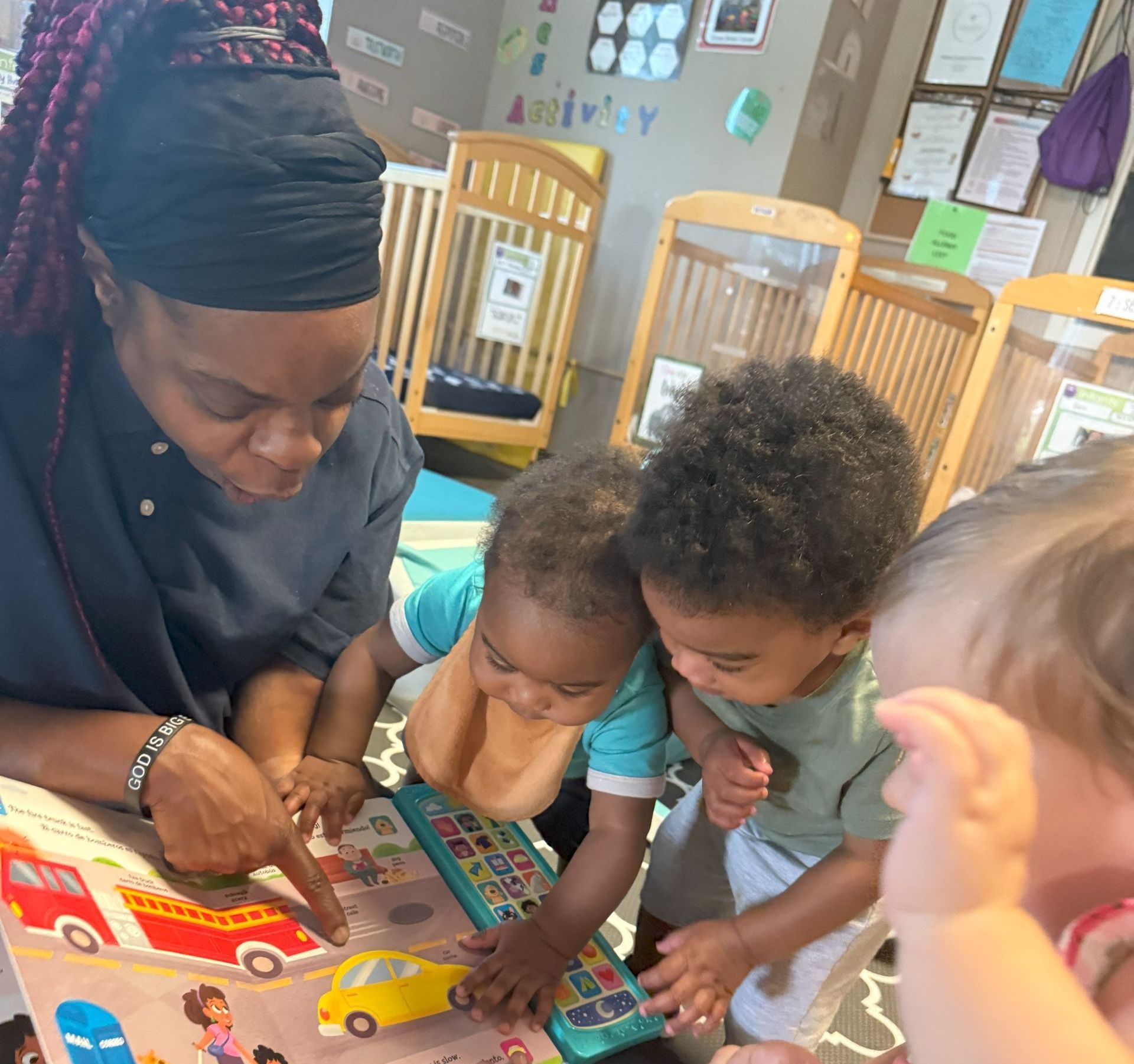 A woman is teaching children at a table.