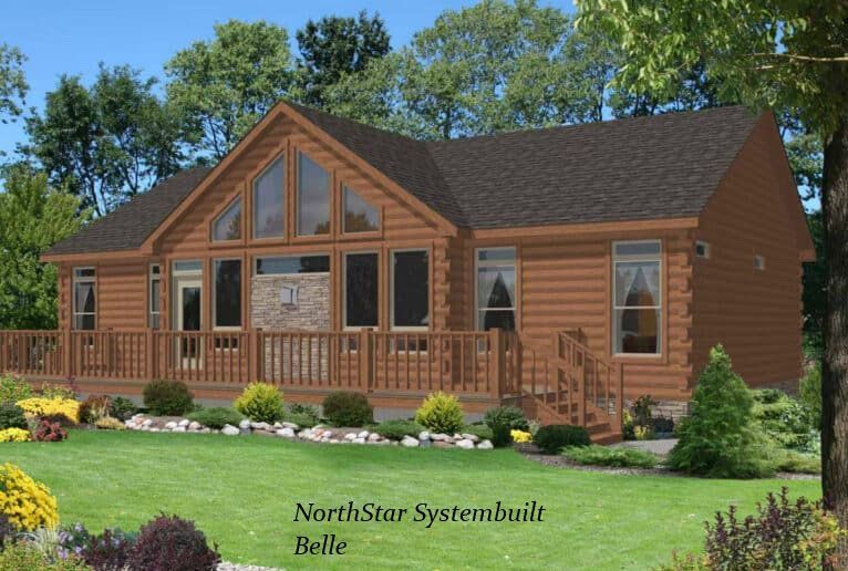 Log cabin style home with large windows and a wraparound deck, set in a grassy yard.