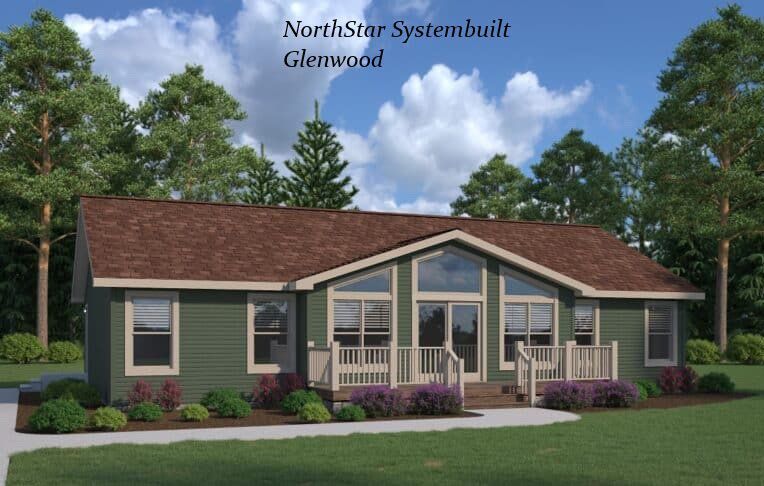 Green house with brown roof, front porch, and large front windows, set in a yard with trees.