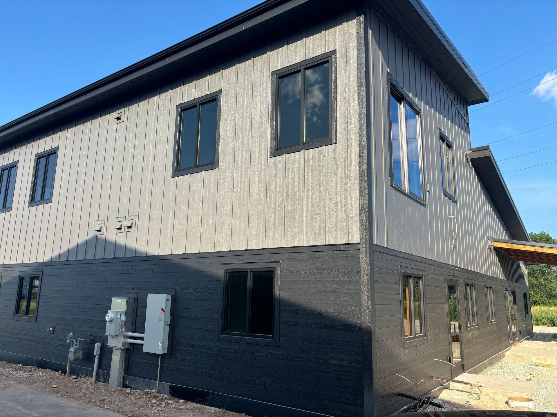 A large building with a lot of windows is being built.