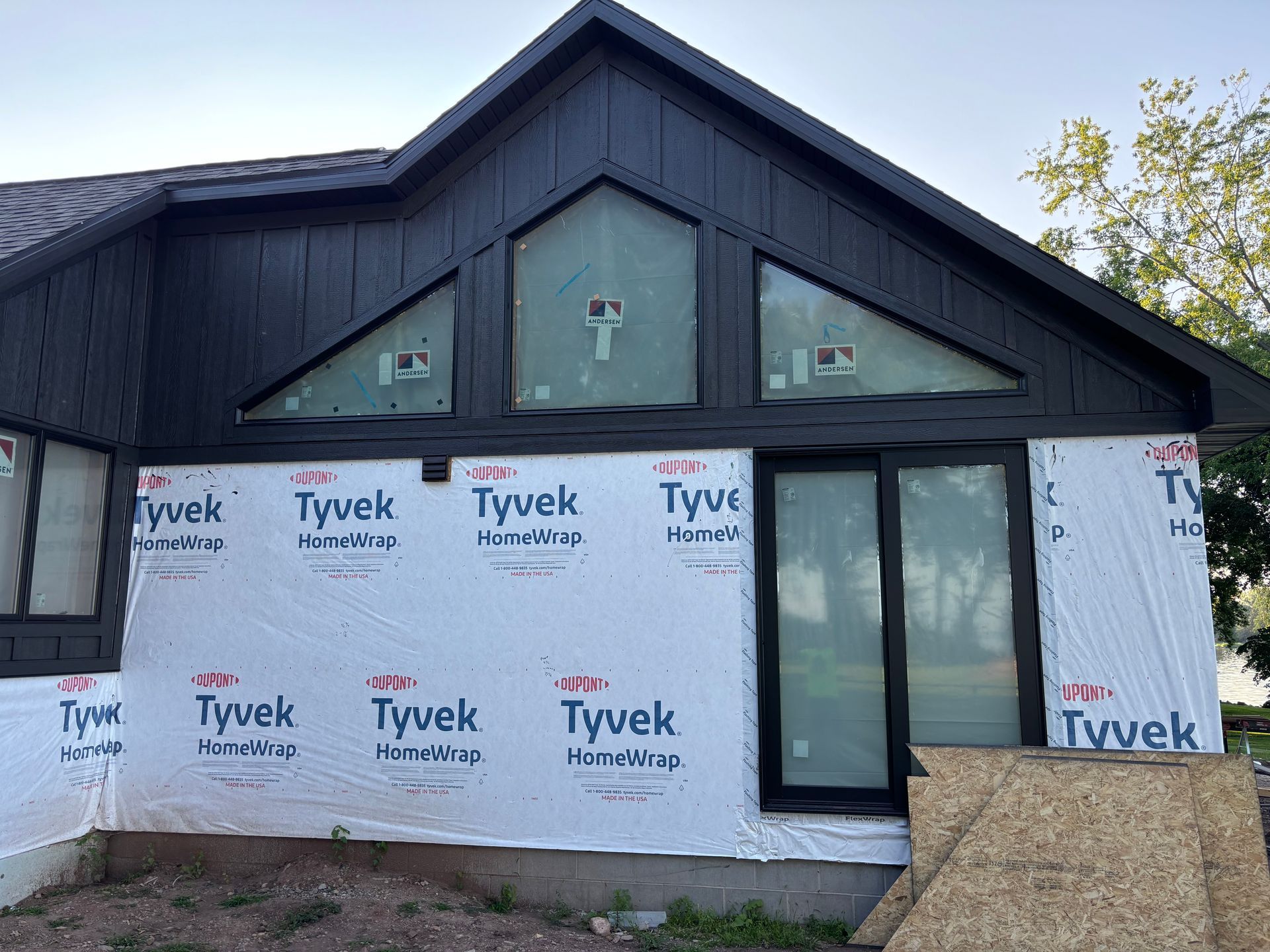 A house with a lot of windows is being remodeled.